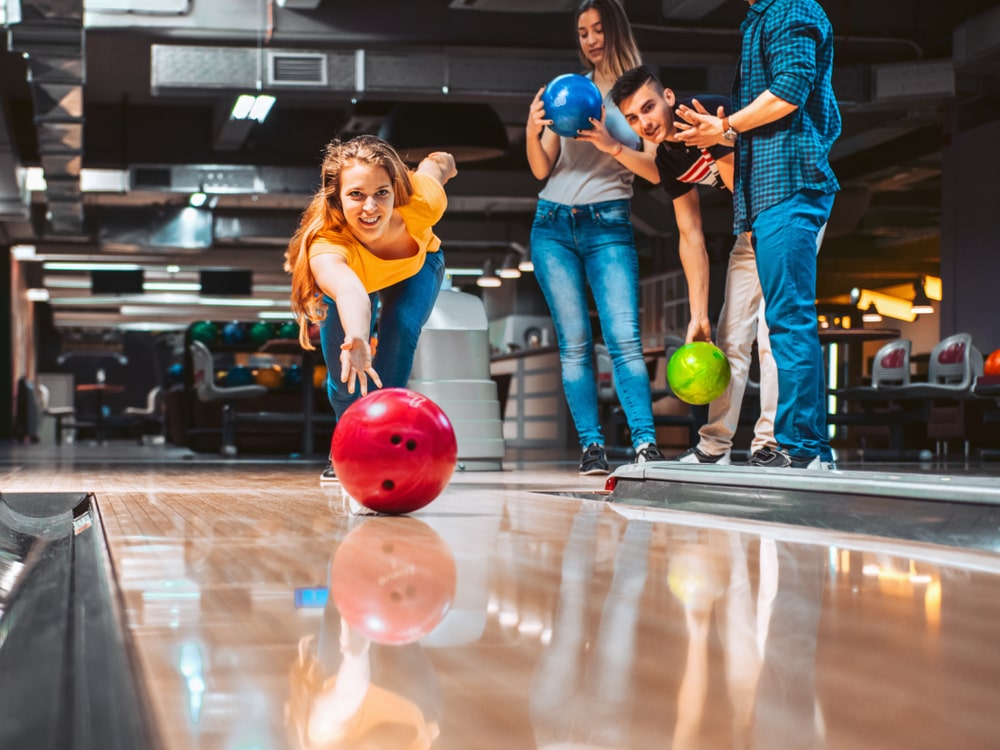 Image of people playing bowling and mini golf